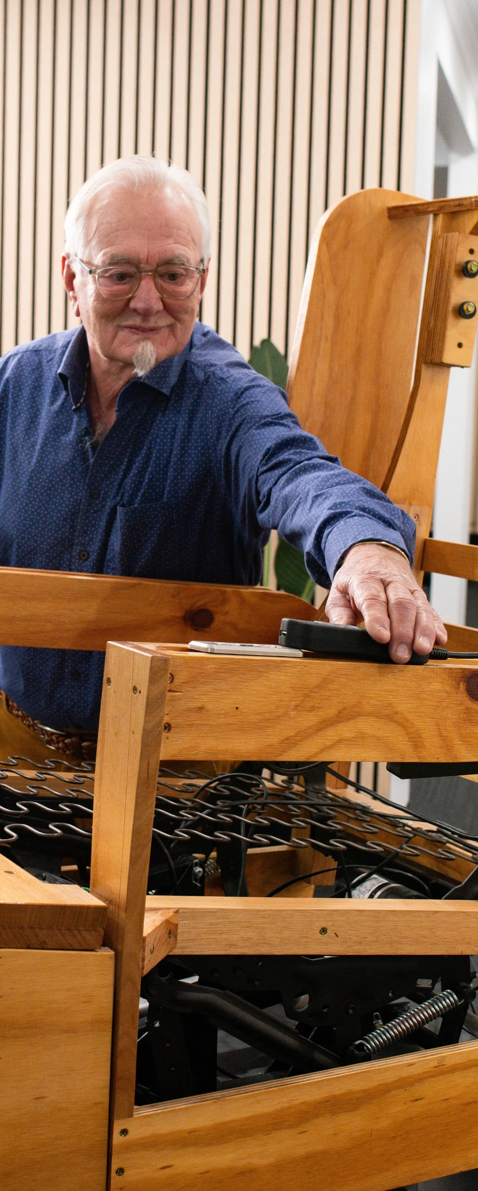Posture Care founder with the timber frame and mechanism of a tailor-made recliner